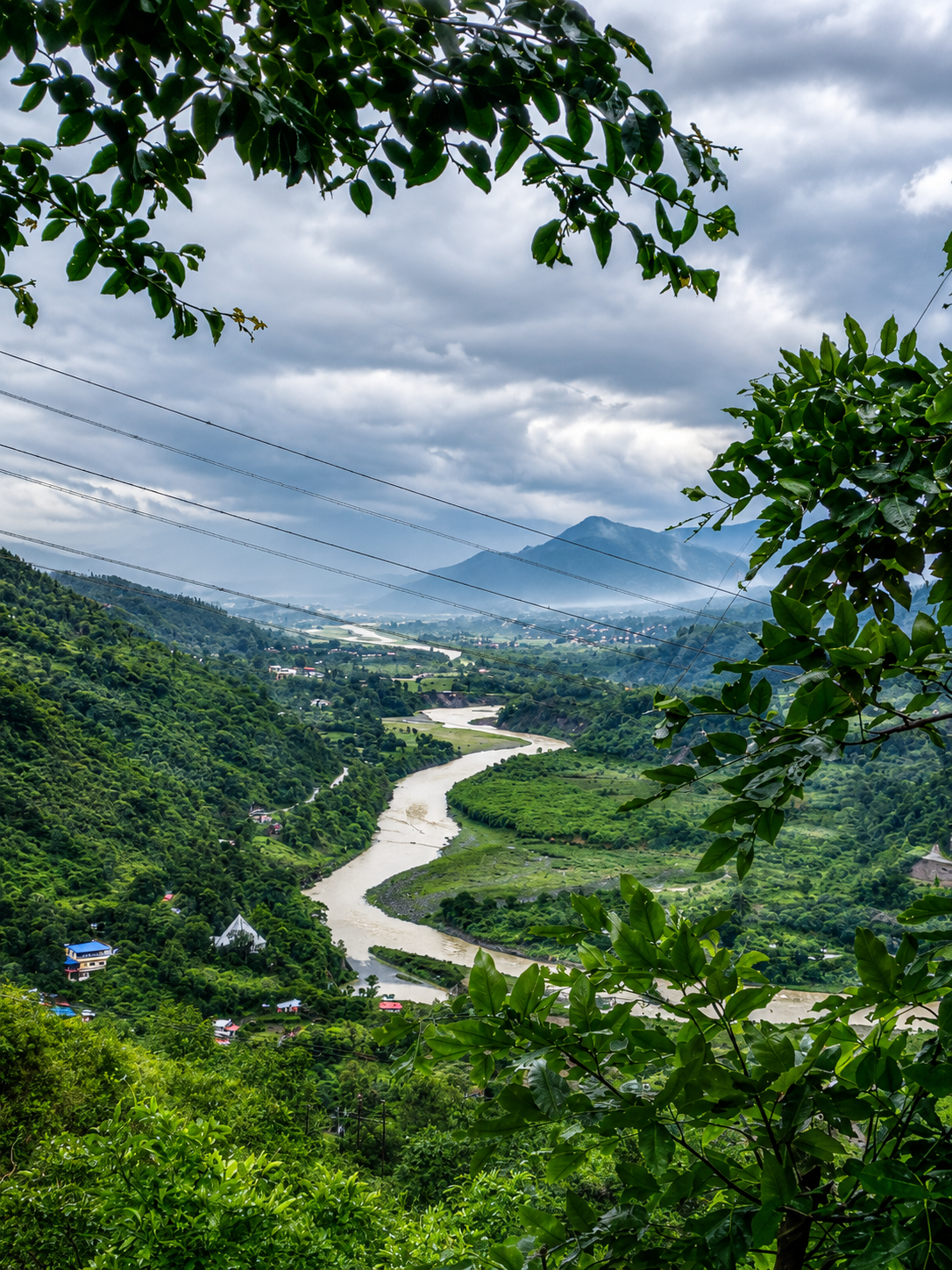 Outdoor deck overlooking green valley and river